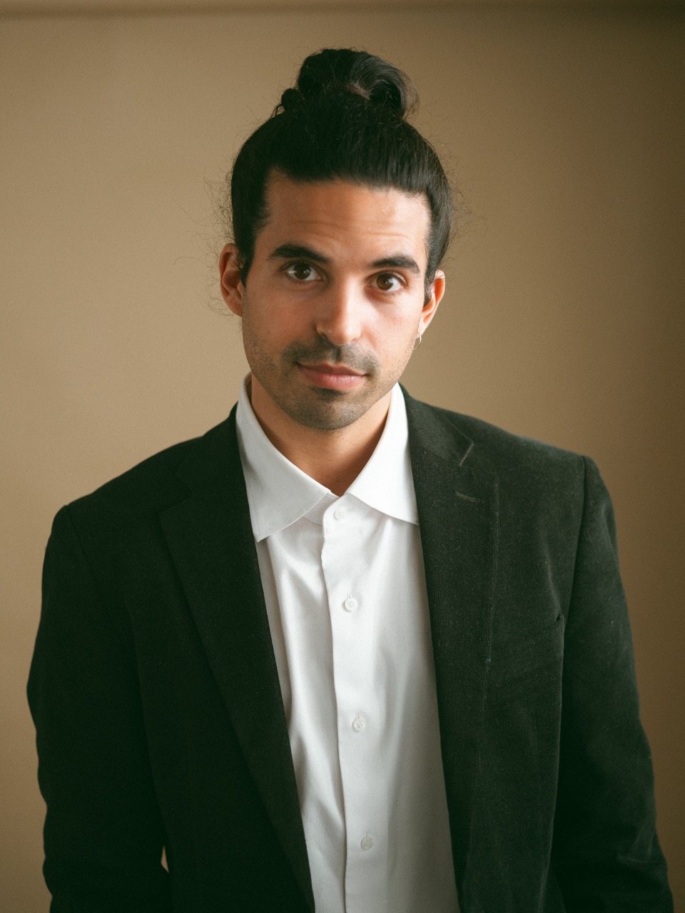 Kai Gluska portrait in blazer